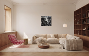Under the Weight of Two Shadows shown unframed in a neutral living room with a striped sofa and bookshelves