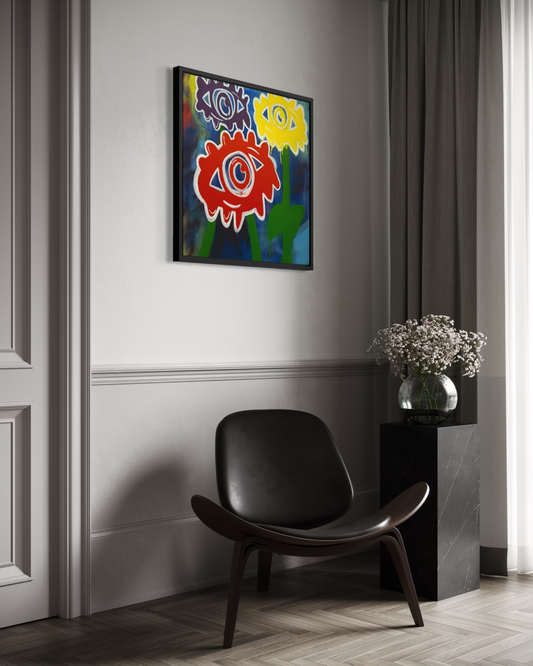 Adivino Gallery original colorful eye flower artwork displayed in a black frame above a modern chair