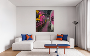 Eyes Across the Bar shown unframed above a white sectional sofa in a living room